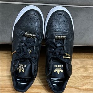Adidas Black Sneakers with Gold Accents